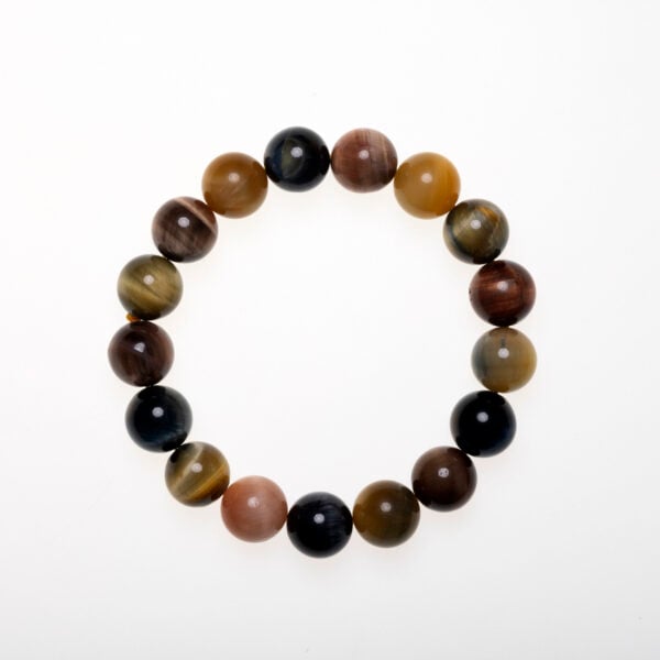 A Fluorite Crystal Bracelet featuring multi-colored Tiger’s Eye beads, designed to support clarity, emotional balance, and inner strength.