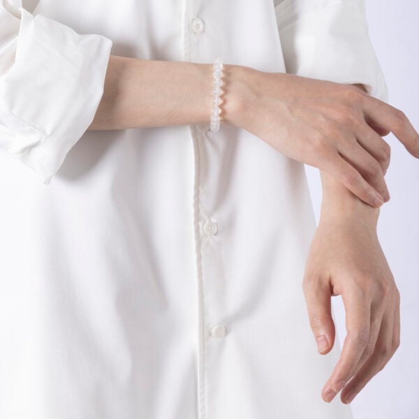 Moonstone Crystal Bracelet featuring luminous round beads — designed to support emotional balance, enhance intuitive calm, and restore inner peace.