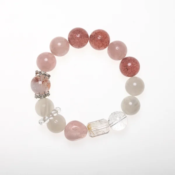 A rose quartz bracelet featuring soft pink and white stones with a mix of crystal accents, symbolizing love, healing, and feminine energy.