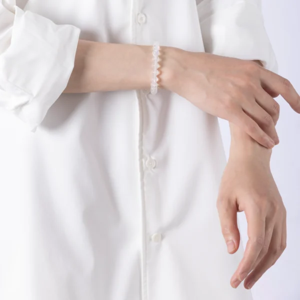 Moonstone Crystal Bracelet featuring luminous round beads — designed to support emotional balance, enhance intuitive calm, and restore inner peace.