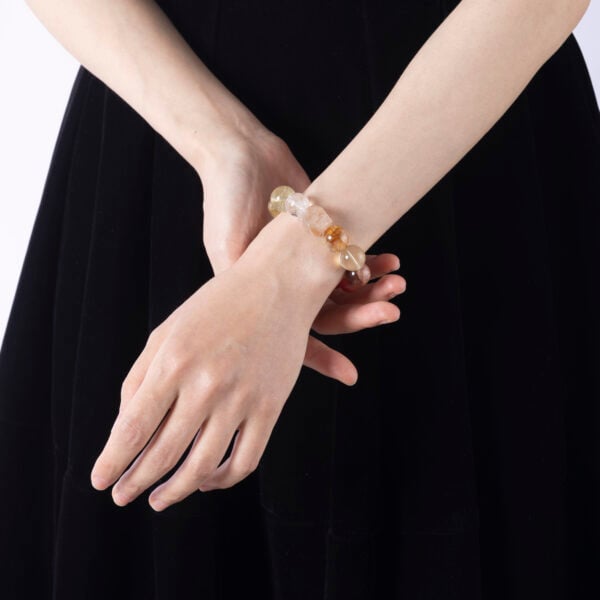 Woman wearing aura protection crystal bracelet